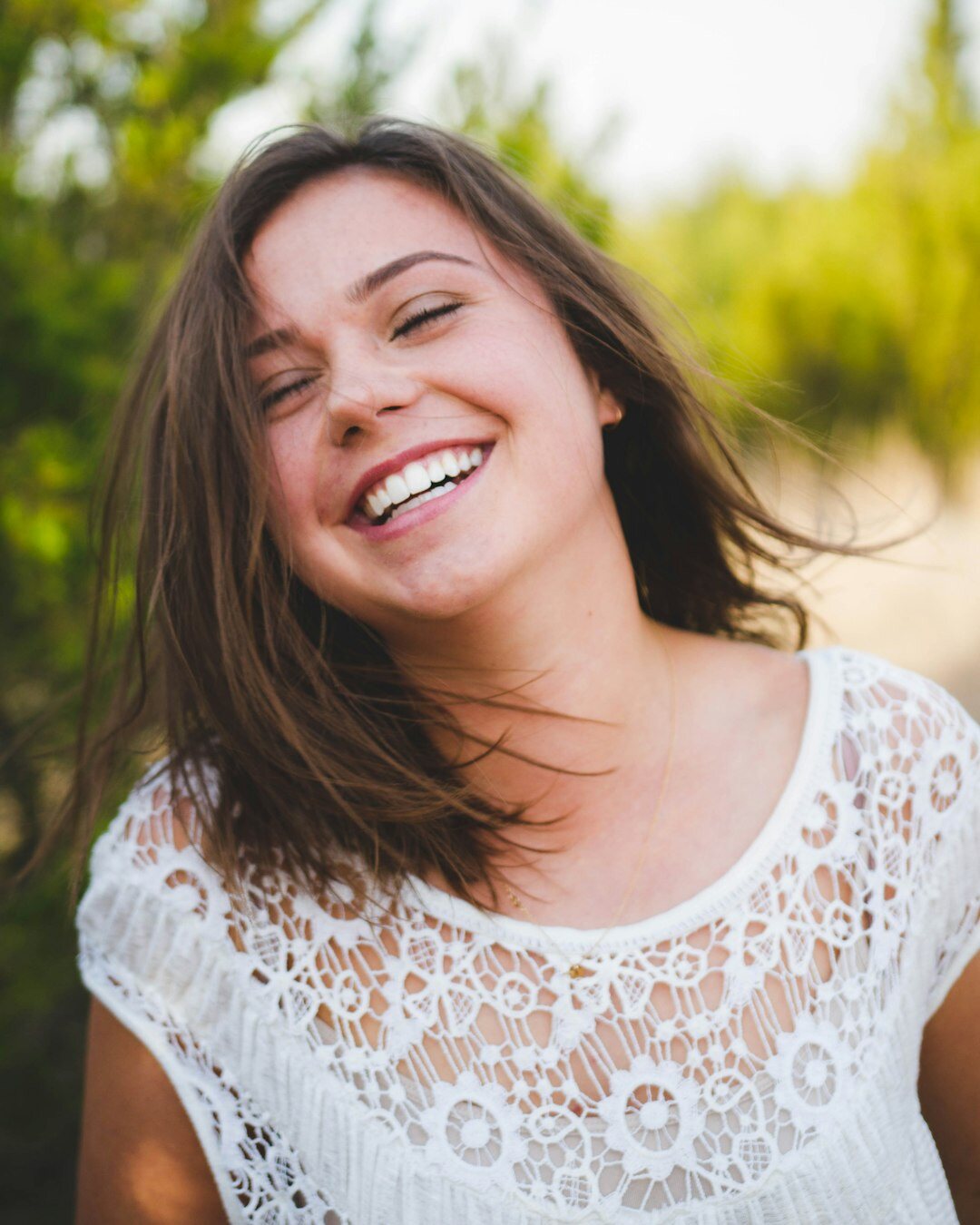 confident woman smiling broadly