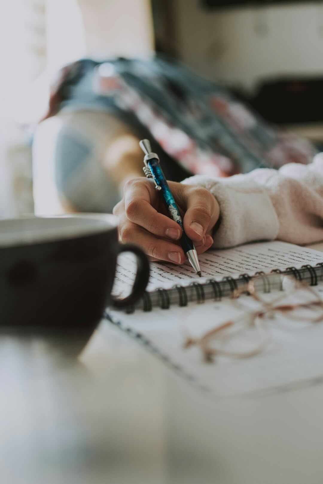 person journaling thoughts